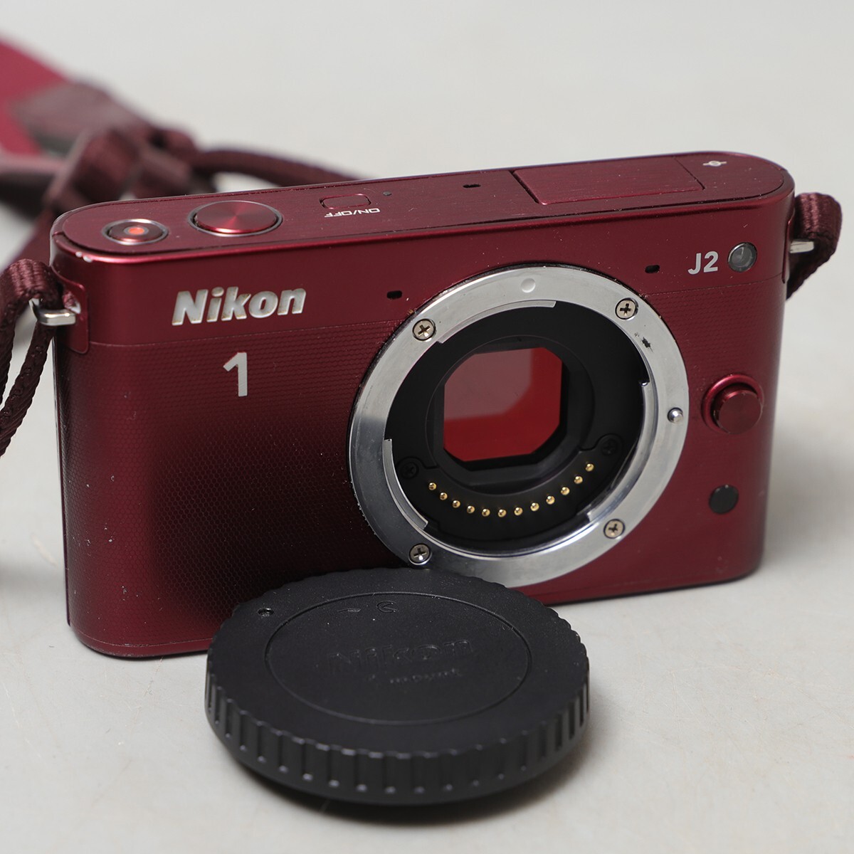 PQ428. Nikon 1 J2 ボディ ニコン ミラーレス一眼カメラ レッド 通電シャッター確認済